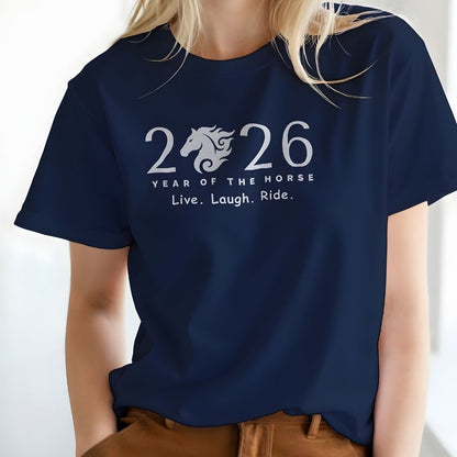 Navy blue t-shirt with '2026 Year of the Horse' design worn by a person. Live Laugh Ride T-Shirt for Horse Lovers, Riding Apparel, Barn Wear Tee