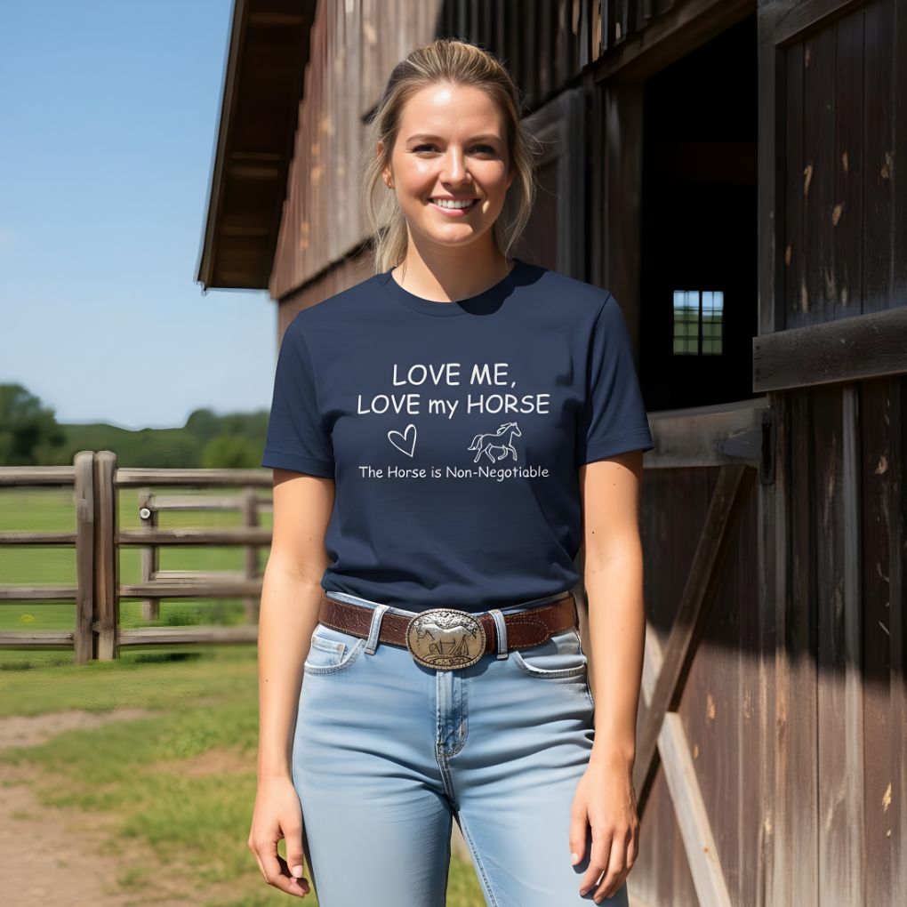 Woman wearing a navy blue t-shirt with horse-themed text, standing in front of a wooden building. Love Me, Love my Horse T-Shirt for Horse Lovers, Horse Riding Tee for Trail Riding