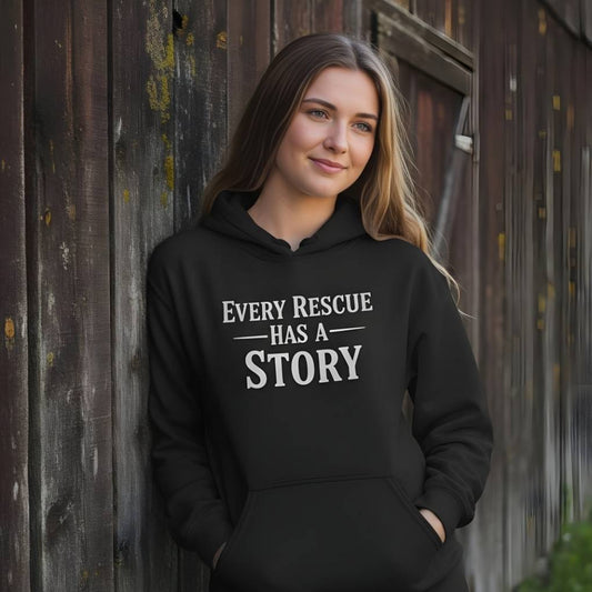 Woman wearing a black hoodie with 'Every Rescue Has a Story' text against a wooden background. Every Rescue has a Story Hoodie for Horse Lovers, Horse Rescue Hoodie for Trail Riding