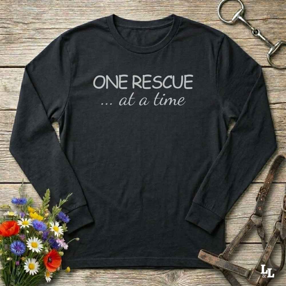 A black long-sleeve t-shirt with the text 'ONE RESCUE at a time'