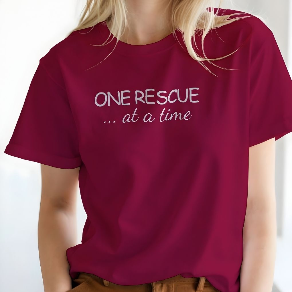Maroon t-shirt with 'ONE RESCUE ... at a time' text worn by a person on a white background. One Rescue at a Time T-Shirt Just Giving Tee, for Horse Lovers, Trail Riding Tee
