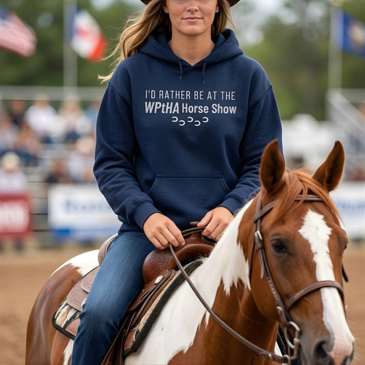 Person riding a horse wearing a hoodie with text at a horse show event.  I'd Rather be at the WPtHA Horse Show Hoodie for Pinto Horse Lovers, fund raising tee for Wisconsin Pinto Horse Association