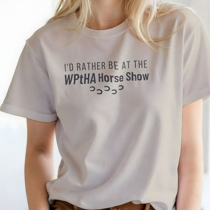 White t-shirt with text 'I'd rather be at the WPtHA Horse Show' worn by a person. Navy Blue I'd Rather be at the WPtHA Horse Show T-shirt for Pinto Horse Lovers, Trail Riding Tee, Charity fund raising tee for Wisconsin Pinto Horse Association
