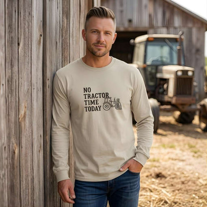 Man wearing a shirt with 'No Tractor Time Today' text standing next to a barn with a tractor in the background. No Tractor Time Today Long Sleeve Tee for Horse Riders, Farmers, Outdoor Sweatshirt Barn Wear
