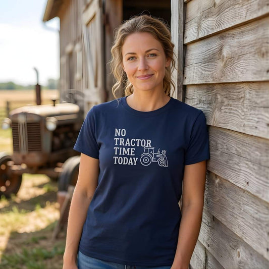 Woman wearing a navy blue t-shirt with 'No Tractor Time Today' text, standing next to a wooden building with a tractor in the background. No Tractor Time Today T-Shirt for Horse Lovers, Outdoor T-Shirt Barn Wear