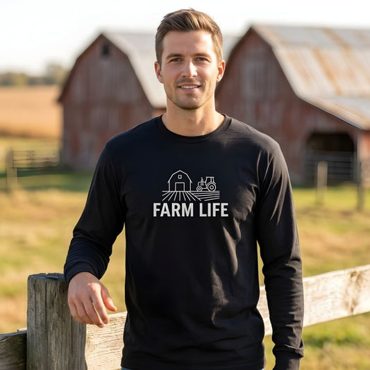 Man wearing a black 'Farm Life' shirt standing in front of a barn. Farm Life Long Sleeve Tee for Horse Riders, Farmer Sweatshirt, Equestrian Apparel