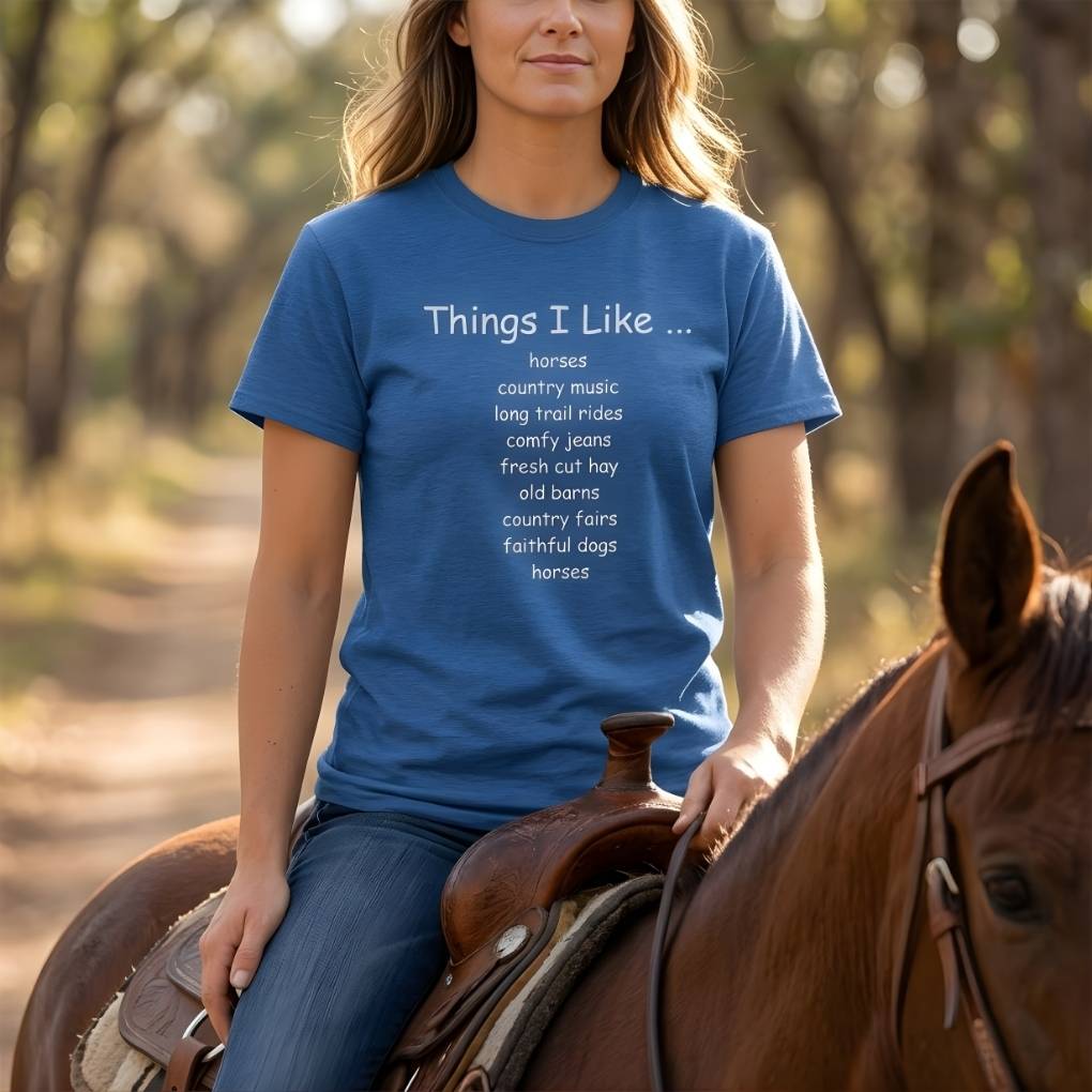 Person riding a horse wearing a blue t-shirt with text. Things I Like T-Shirt for Horse Riders, Outdoor Wear Equestrian Apparel, Country Tee