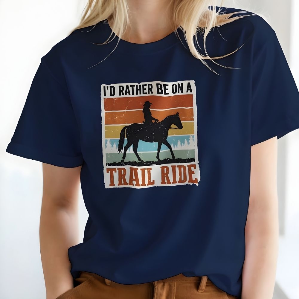 Navy blue t-shirt with horse and rider graphic and text 'I'd Rather Be On A Trail Ride' worn by a person. I'd Rather be on a Trail Ride T-Shirt for Horse Lovers, Trail Riding Tee. Perfect gift for horse lover. 