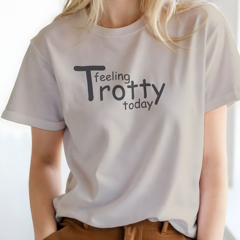 Person wearing a white t-shirt with 'Feeling Trotty today' text on a plain background. Feeling Trotty Today T-Shirt for Horse Riders, Equestrian Apparel Trail Riding Tee, perfect gift for horse lovers
