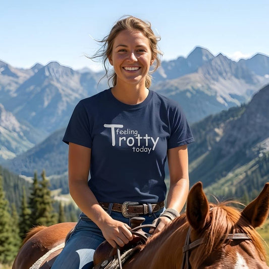 Person riding a horse with mountains in the background wearing a 'Feeling Trotty Today' shirt. Feeling Trotty Today T-Shirt for Horse Riders, Equestrian Apparel Trail Riding Tee, perfect gift for horse lovers