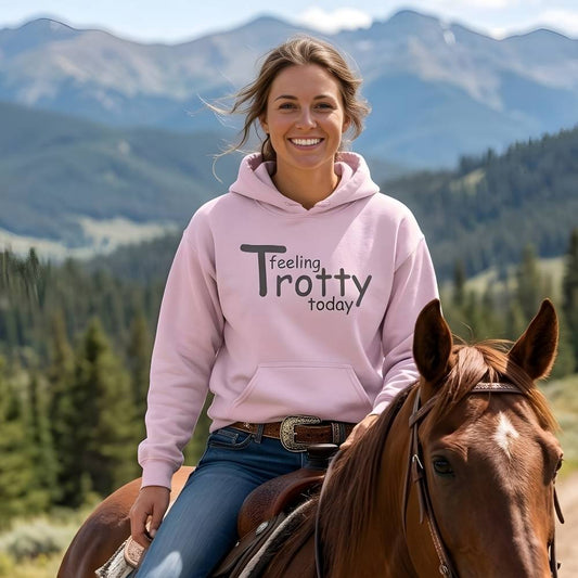 Woman in a pink hoodie riding a horse with mountains in the background. Feeling Trotty Today Hoodie for Horse Lovers, Trail Riding Hoodie Equestrian Wear, perfect gift for horse lover