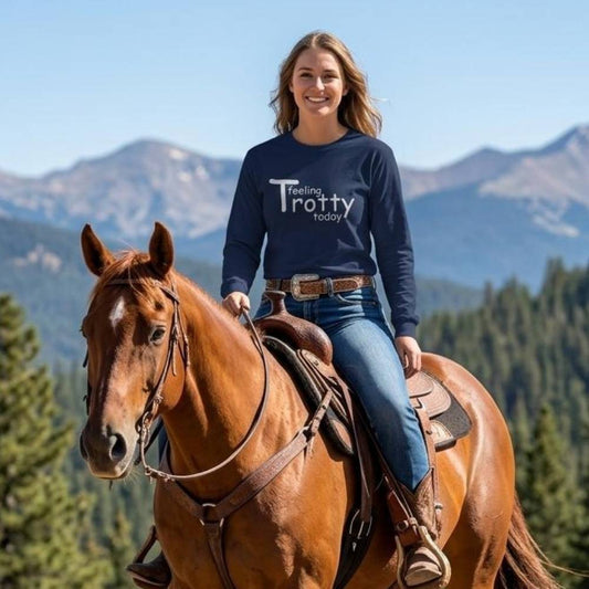 Woman riding a horse with mountains in the background wearing a shirt that says 'Feeling Trotty today'. Feeling Trotty Today Long Sleeve Top for Horse Riders, Trail Riding Sweatshirt, perfect gift for horse lovers