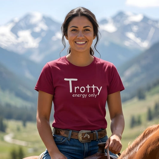 Woman wearing a red 'Trotty energy only' shirt riding a horse with mountains in the background. Trotty Energy Only T-Shirt for Horse Lovers, Trail Riding Tee Equestrian Wear, perfect gift for horse rider, mothers day present, fathers day present, xmas gift