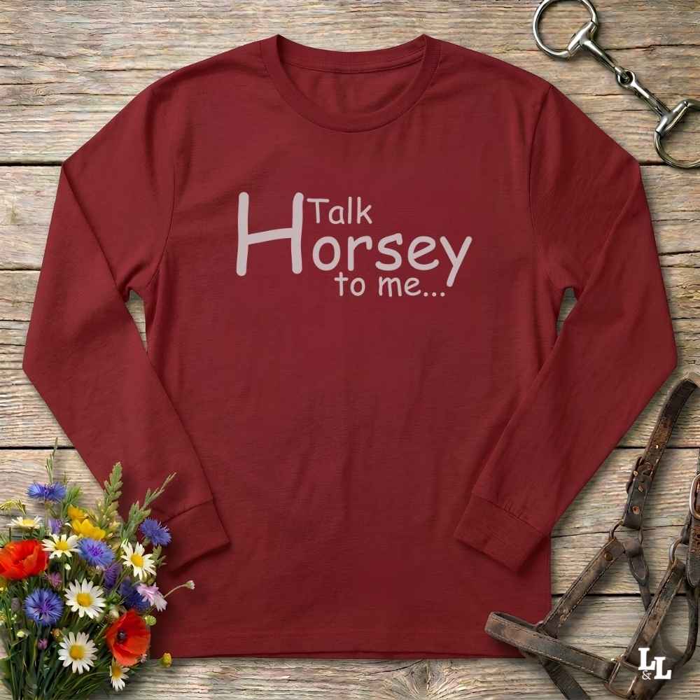 A long-sleeve crewneck shirt in maroon red with the text 'Talk Horsey to me.