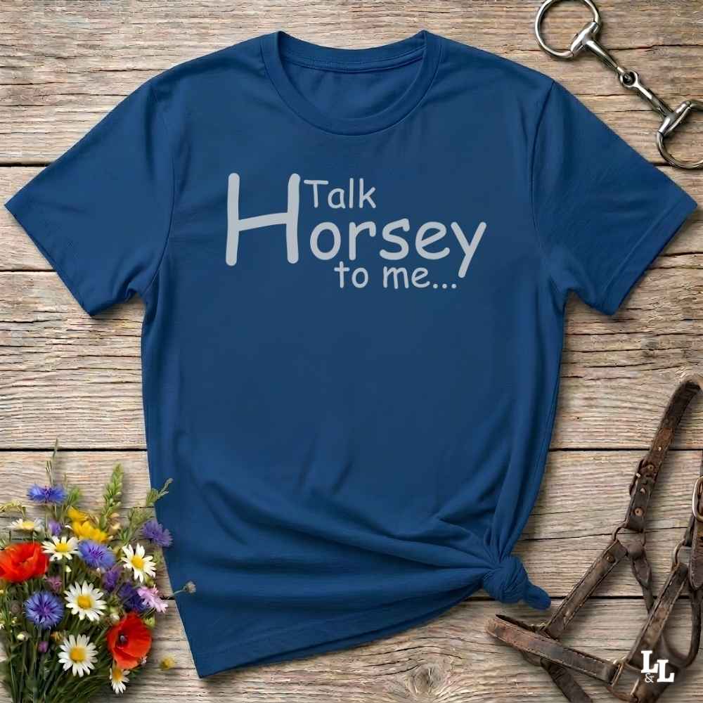 A navy blue short-sleeve t-shirt with the white printed text 'Talk Horsey to me.
