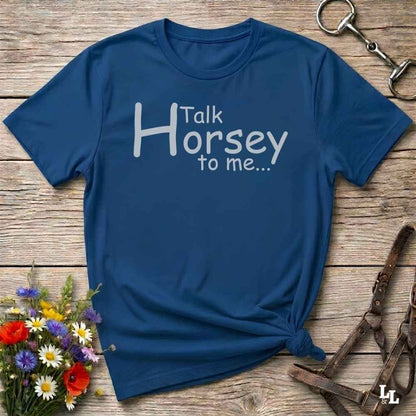A navy blue short-sleeve t-shirt with the white printed text 'Talk Horsey to me.