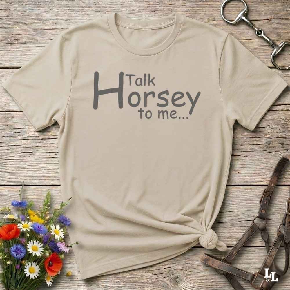A beige graphic t-shirt with the text 'Talk Horsey to me.