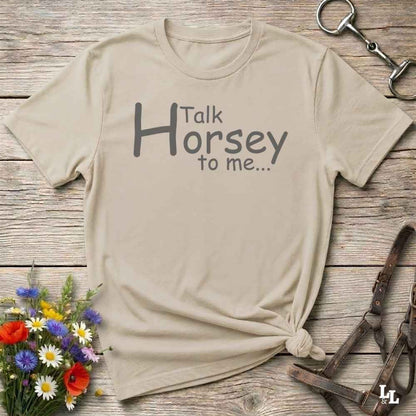 A beige graphic t-shirt with the text 'Talk Horsey to me.