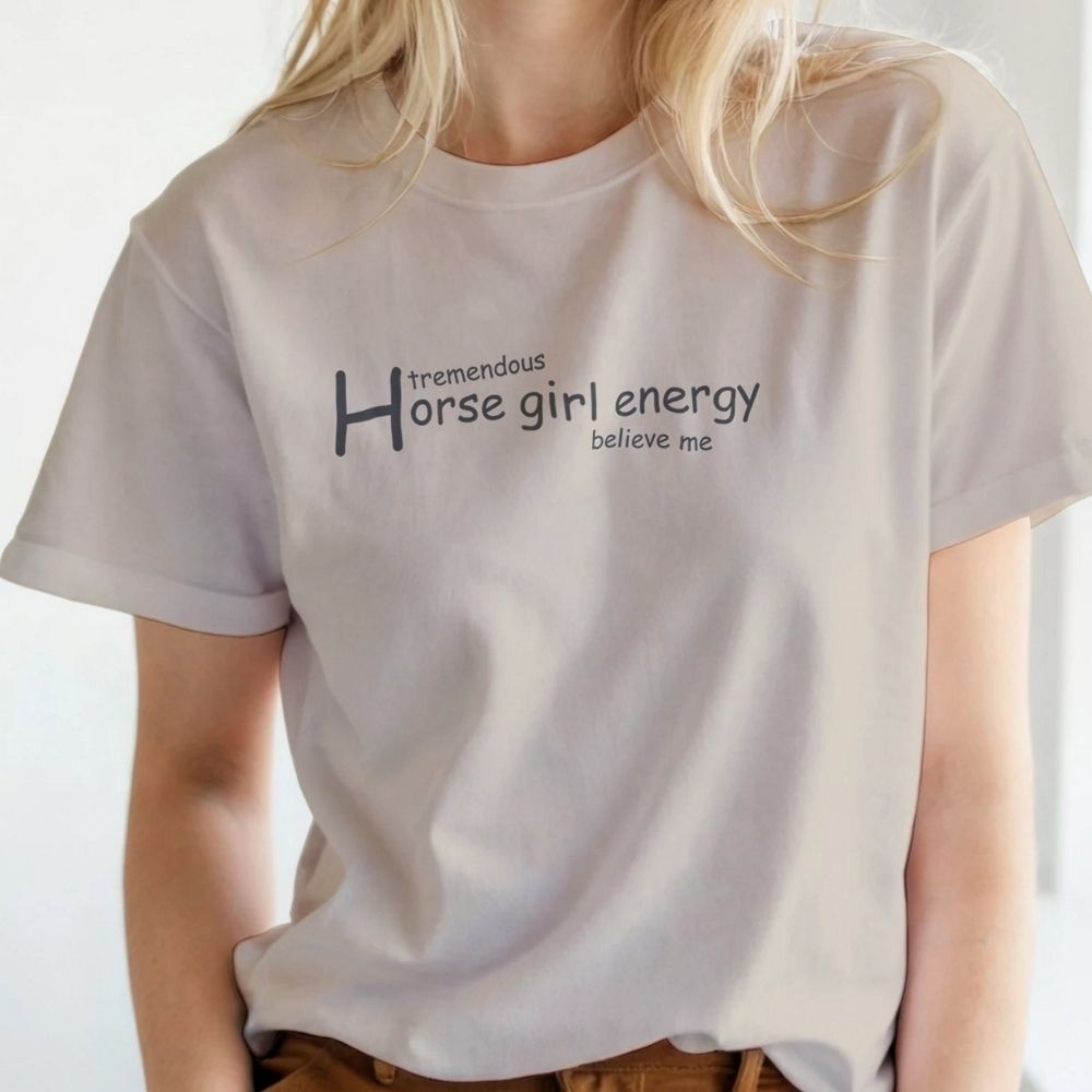 Person wearing a white t-shirt with 'tremendous horse girl energy believe me' text. Horse Girl Energy T-Shirt gift for Horse Riders, Horse Lover Tee, Trail Riding Top. Perfect gift for horse lover, gift for mothers day, xmas gift for horse riders.