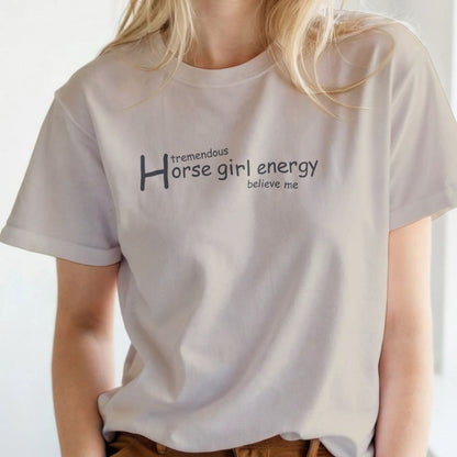 Person wearing a white t-shirt with 'tremendous horse girl energy believe me' text. Horse Girl Energy T-Shirt gift for Horse Riders, Horse Lover Tee, Trail Riding Top. Perfect gift for horse lover, gift for mothers day, xmas gift for horse riders.