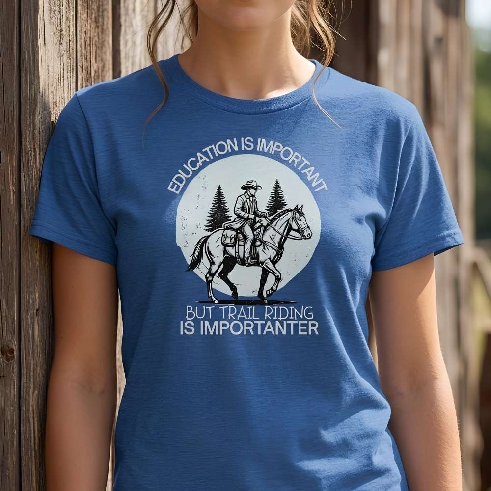 Person wearing a blue t-shirt with a graphic and text about trail riding. Education is Important T-Shirt for Horse Lovers, Equestrian Wear Short Tee, horse girl shirt, horse mom shirt, horse lover, horse girl, Funny horse lover gifts, Funny horse shirts, Horse girl gifts, Equestrian graphic tees, fathers day gift, Sarcastic horse shirt