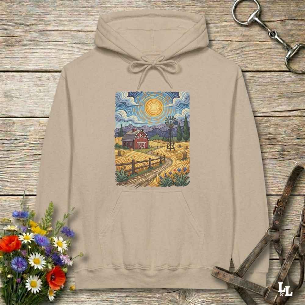 beige hoodie with a farm scene print on a wooden surface with flowers and horse equipment. Gogh to the Barn.