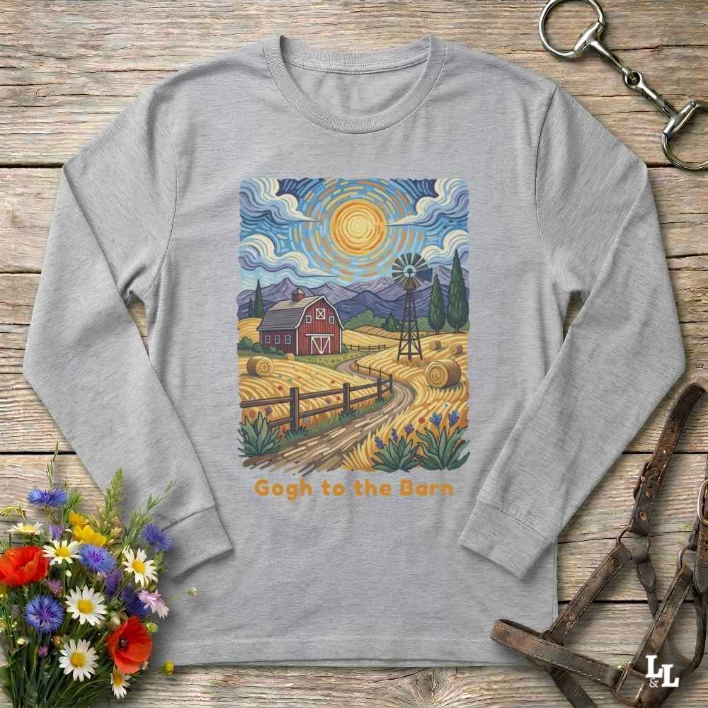 A light gray long-sleeve t-shirt with a colorful graphic print of a farm scene in a Van Gogh style, featuring a red barn, yellow fields, a windmill, and mountains under a swirling blue sky. The text 'Gogh to the Barn' is printed below the graphic.