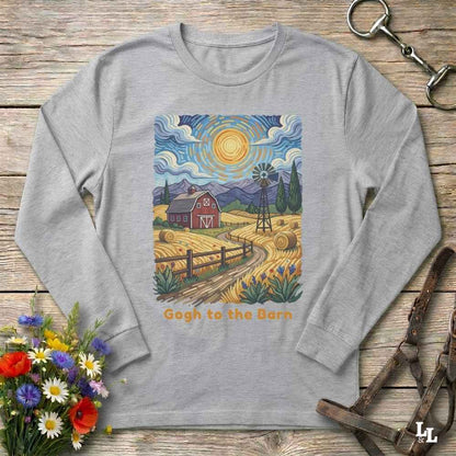A light gray long-sleeve t-shirt with a colorful graphic print of a farm scene in a Van Gogh style, featuring a red barn, yellow fields, a windmill, and mountains under a swirling blue sky. The text 'Gogh to the Barn' is printed below the graphic.
