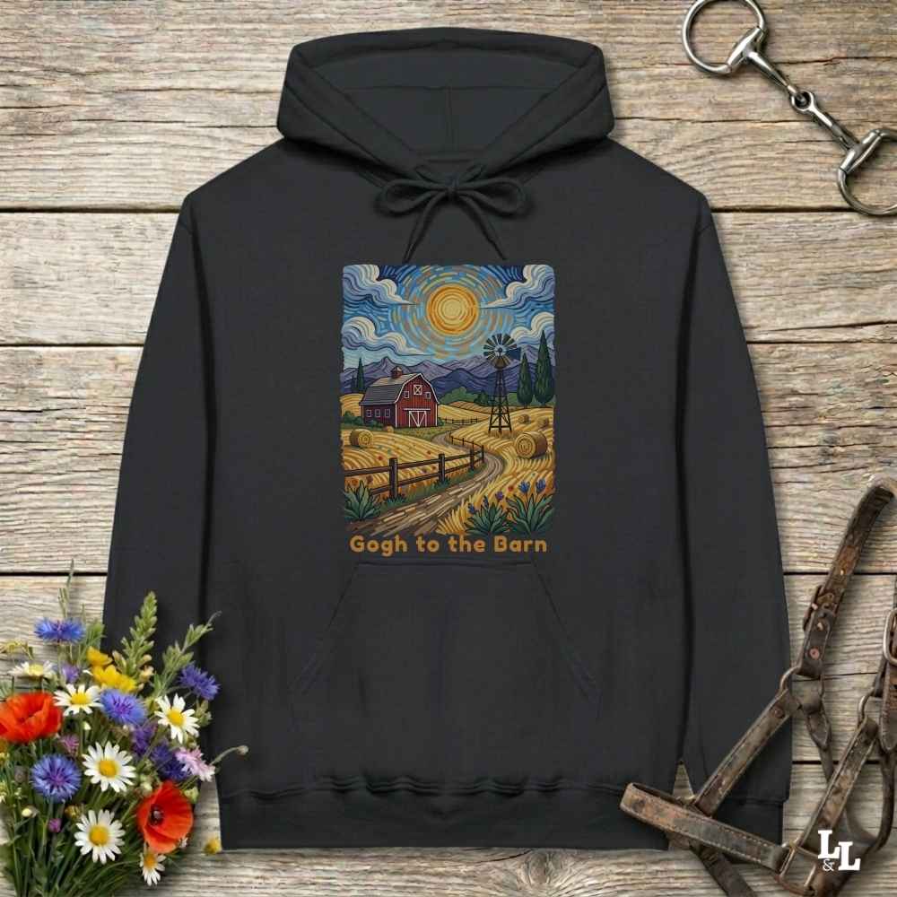black hoodie with a farm scene print on a wooden surface with flowers and horse equipment. Gogh to the Barn.