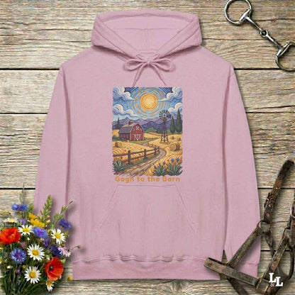 pink hoodie with a farm scene print on a wooden surface with flowers and horse equipment. Gogh to the Barn.