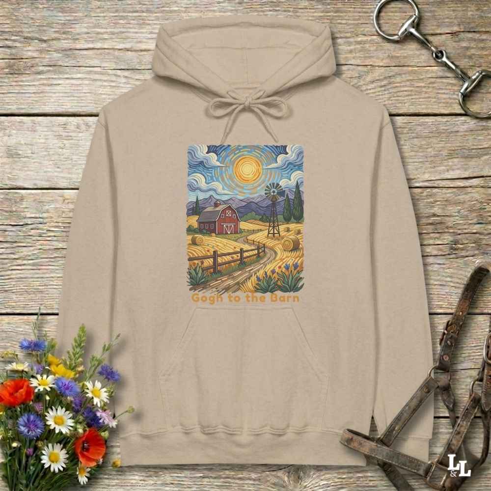 beige hoodie with a farm scene print on a wooden surface with flowers and horse equipment. Gogh to the Barn.