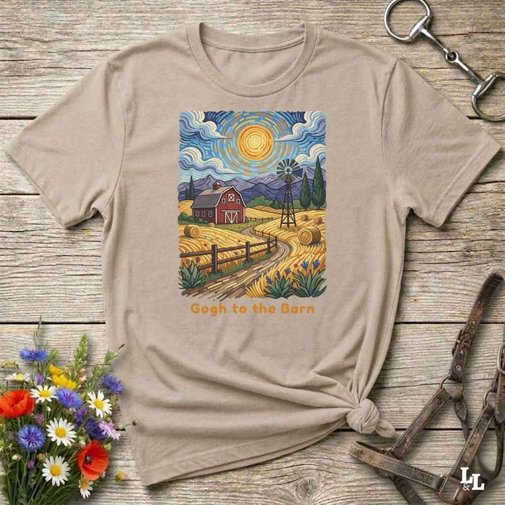 A flat lay mockup of a beige t-shirt featuring Van Gogh-inspired landscape art of a farm, with a red barn, windmill, and hay bales under a swirling sun. Below the image, orange text reads, 'Gogh to the Barn.' Ideal horse lover and barn life gift.