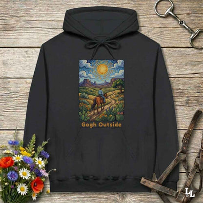 black Hoodie, Gogh Outside graphic design,  lying on wooden floor with equestrian halter and horse bit