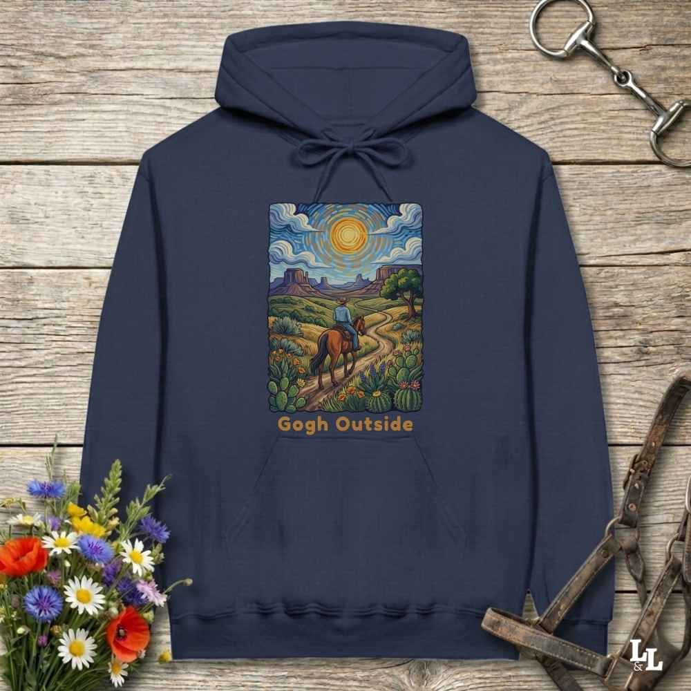navy blue Hoodie, Gogh Outside graphic design,  lying on wooden floor with equestrian halter and horse bit