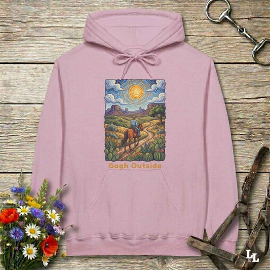 pink Hoodie, Gogh Outside graphic design,  lying on wooden floor with equestrian halter and horse bit