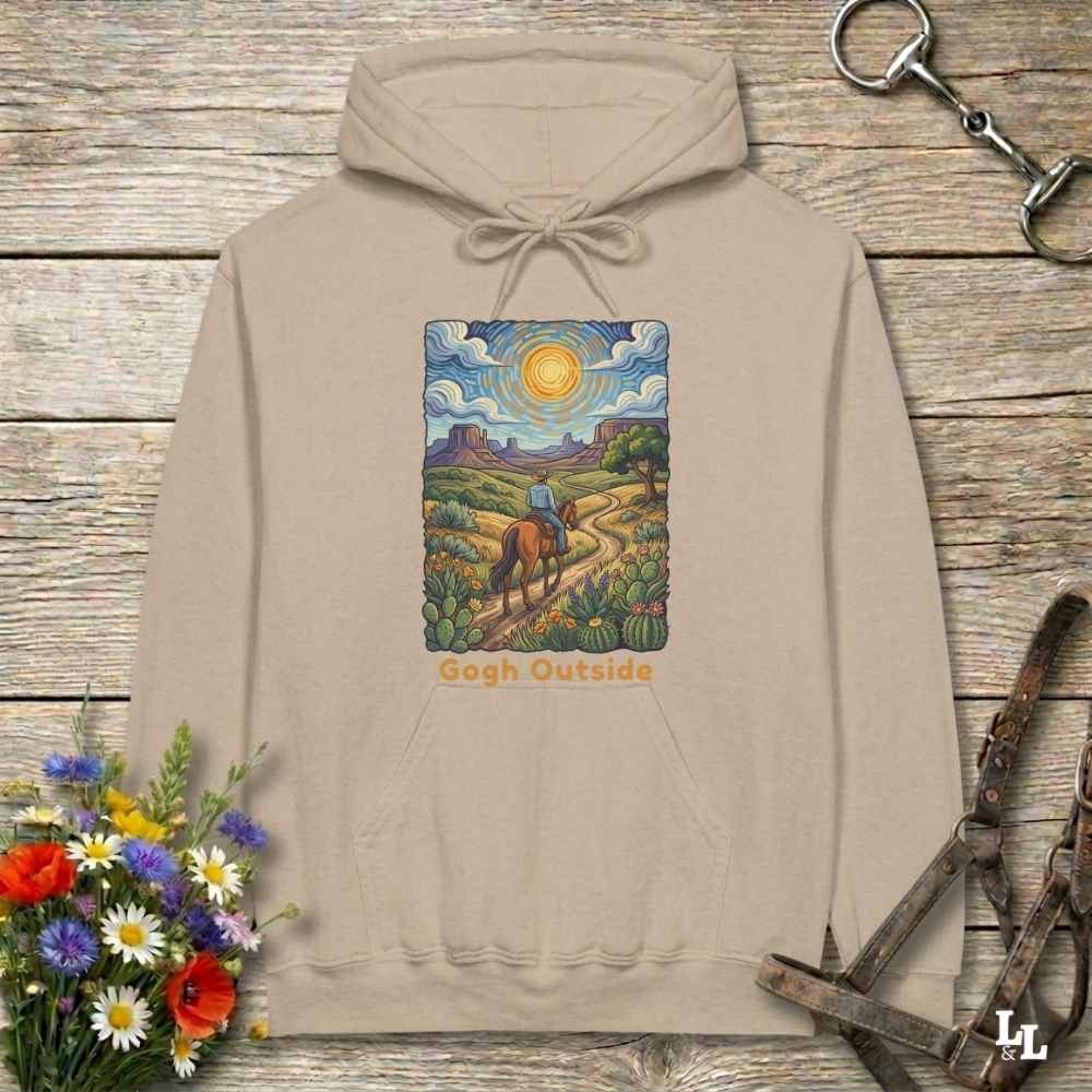 beige Hoodie, Gogh Outside graphic design,  lying on wooden floor with equestrian halter and horse bit