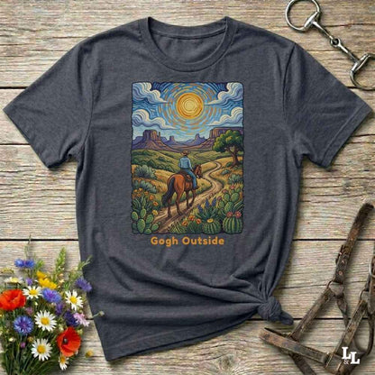 gray t-shirt with a desert scene graphic and 'Gogh Outside' text on a wooden surface with flowers and a key. Perfect gift for horse lovers.