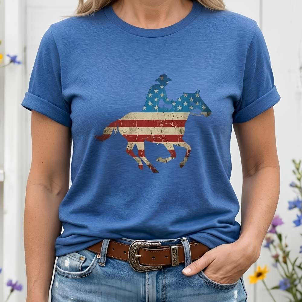 Person wearing a blue t-shirt with a graphic design of a horse and rider on an American flag background.