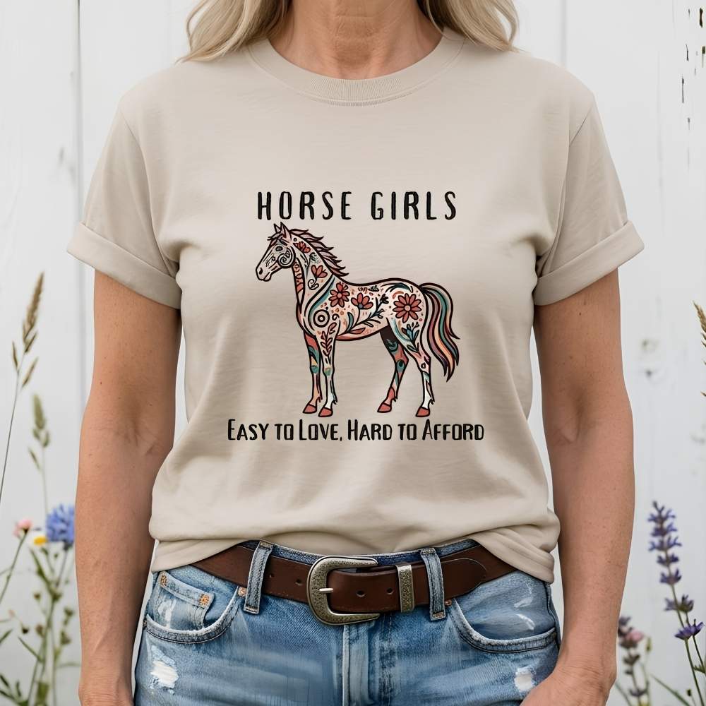 Person wearing a t-shirt with a horse design and text against a white background