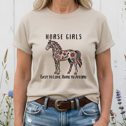 Person wearing a t-shirt with a horse design and text against a white background