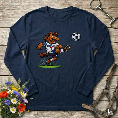 navy blue  long-sleeve shirt with a cartoon horse kicking a soccer ball on a wooden surface with flowers and a horse bridle.