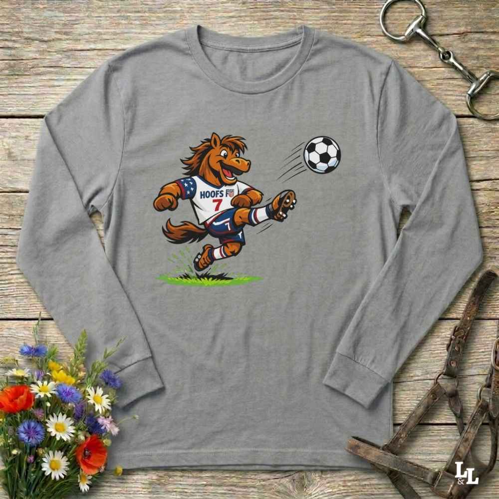 gray  long-sleeve shirt with a cartoon horse kicking a soccer ball on a wooden surface with flowers and a horse bridle.