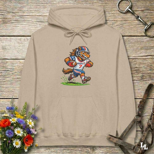 beige  hoodie with horse mascot playing american football, lying on wooden background with equestrian accessories