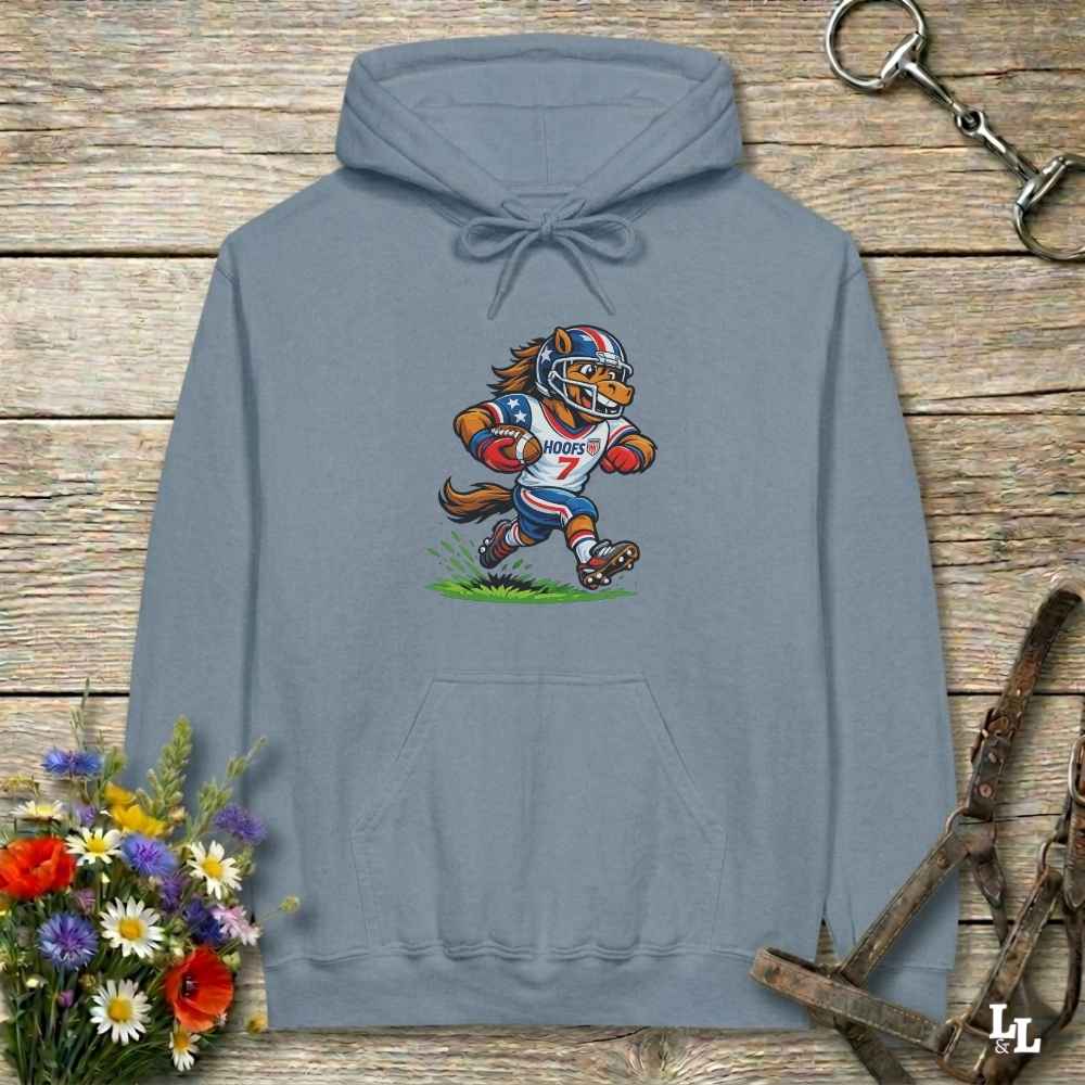 blue hoodie with horse mascot playing american football, lying on wooden background with equestrian accessories