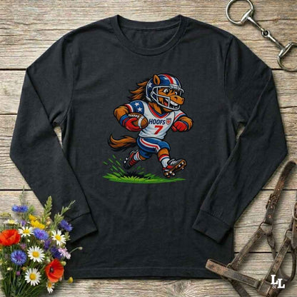 black  long-sleeve shirt with a cartoon horse in a american football uniform on a wooden surface with flowers and a horse halter and bit.