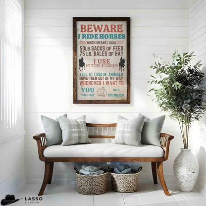 Living room with wooden bench, decorative pillows, and a framed poster on the wall. Western Sign.