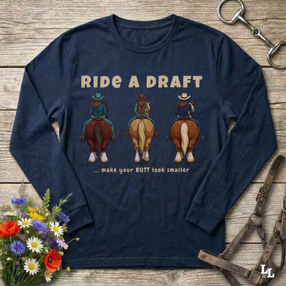 A navy blue long-sleeve t-shirt with a graphic print of three cowboys riding horses and the text 'RIDE A DRAFT .