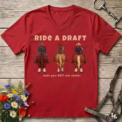 A red V-neck t-shirt with a humorous western graphic that reads 'RIDE A DRAFT .