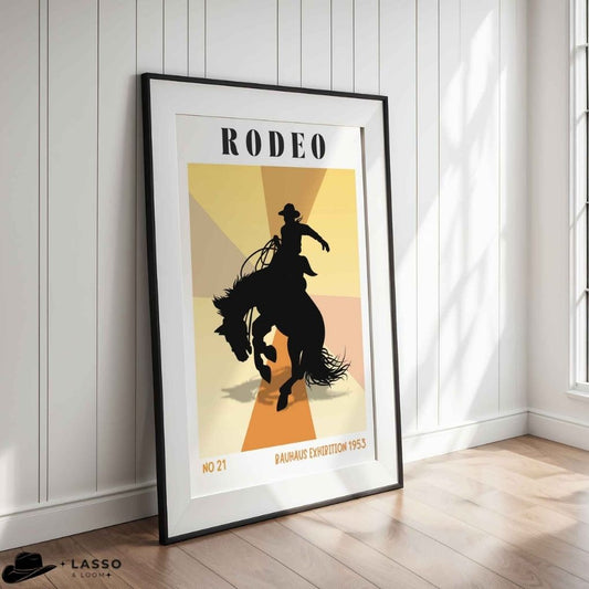 Framed poster of a cowboy riding a bucking horse with 'Rodeo' text on a wall. Bauhaus Vintage Rodeo Poster.