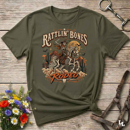 green t-shirt with short sleeves, with halloween design of rattlin'bones rodeo, with skull cowboy riding a horse in the desert